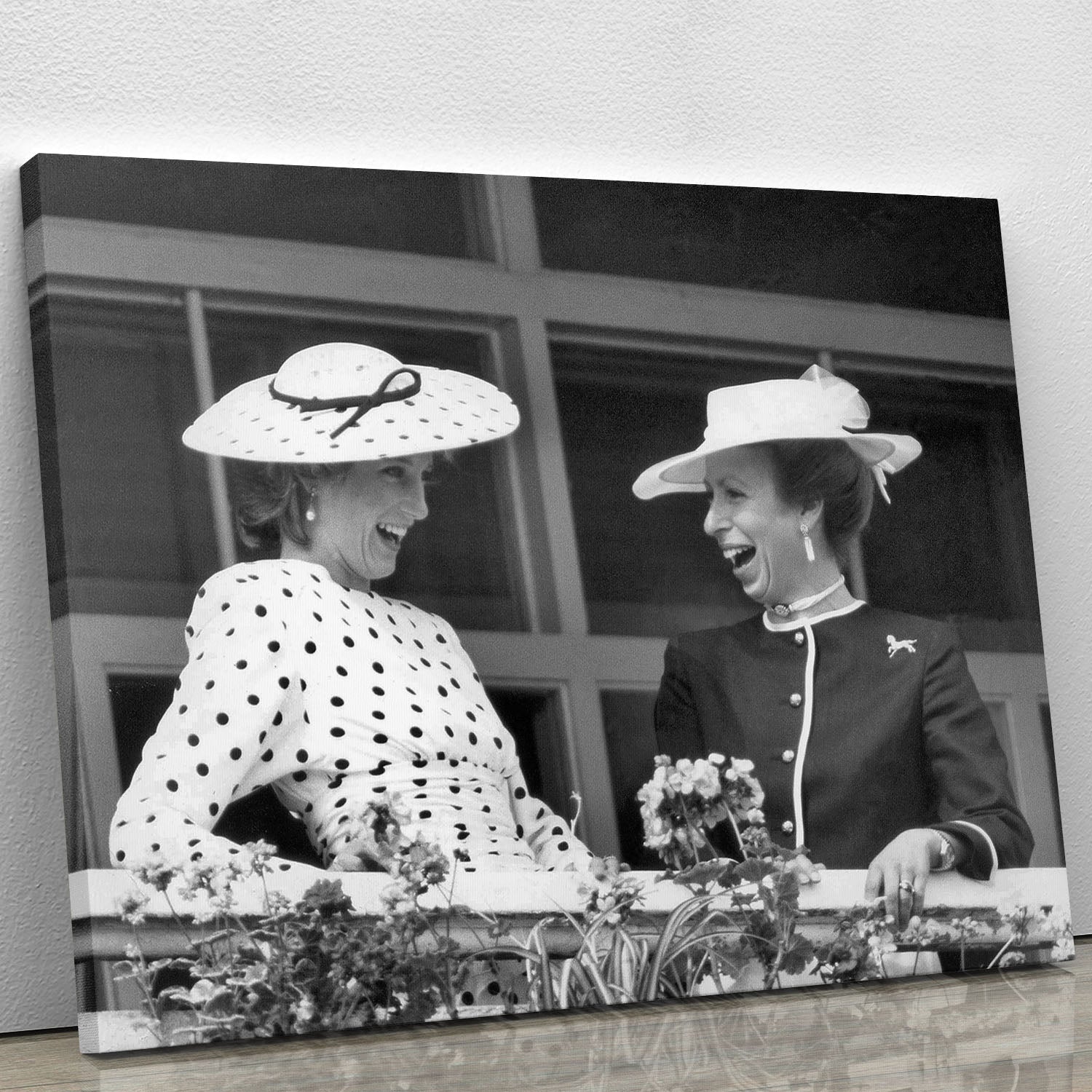 Canvas print of Princess Diana and Princess Anne laughing together at the races, showcasing royal elegance and charm.