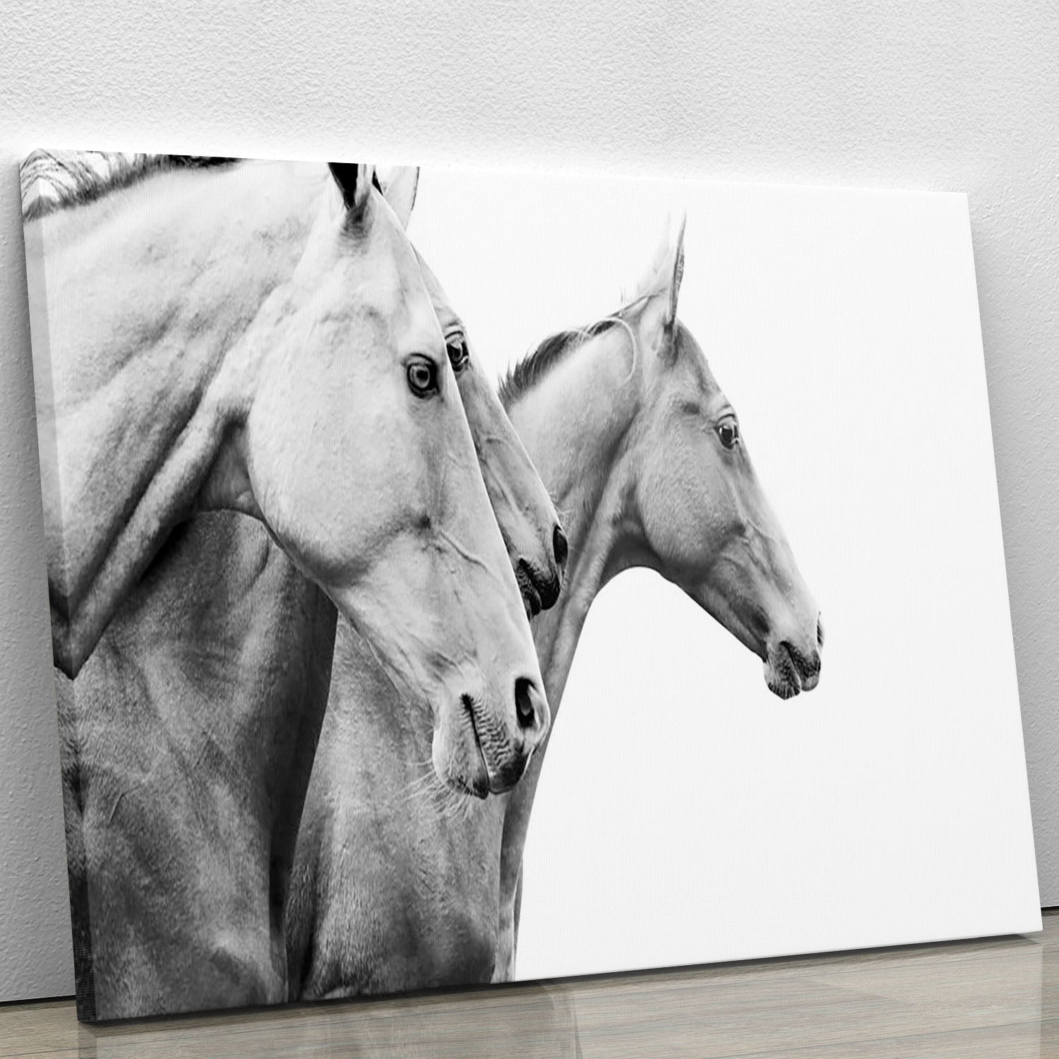 A beautiful canvas print featuring purebred horses in a serene landscape, showcasing their elegance and grace.