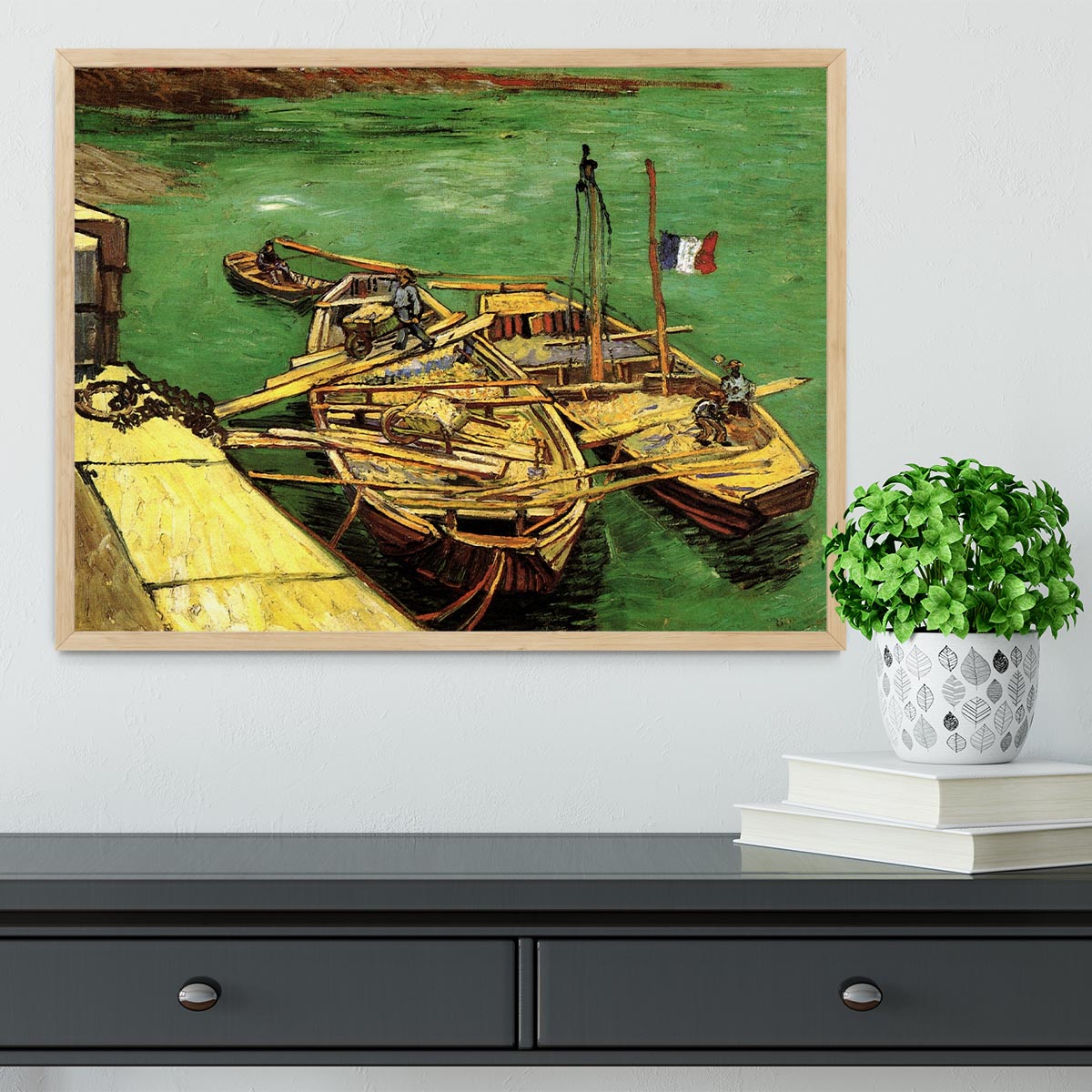 Framed print of Van Gogh's Quay with Men Unloading Sand Barges, showcasing vibrant colors and intricate details.