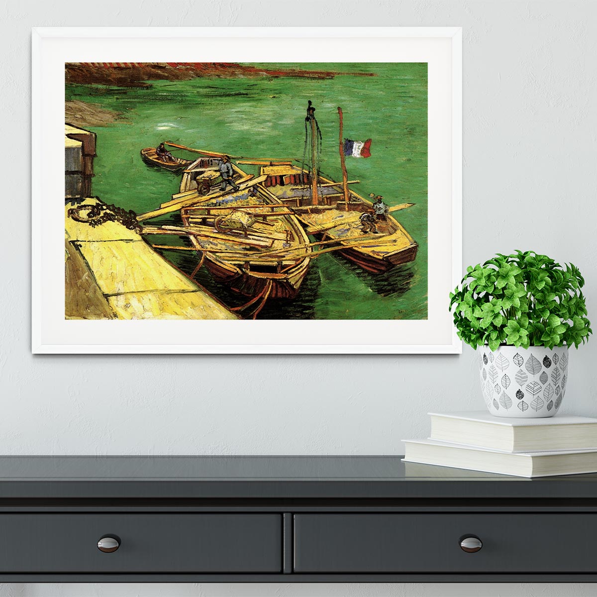 Framed print of Van Gogh's Quay with Men Unloading Sand Barges, showcasing vibrant colors and intricate details.