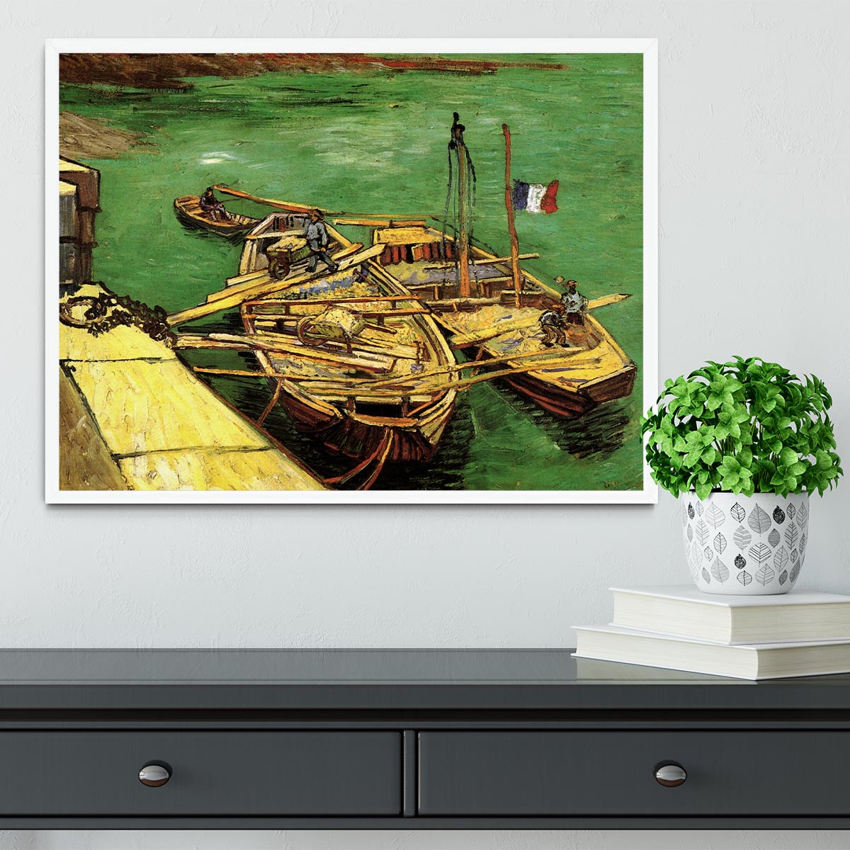 Framed print of Van Gogh's Quay with Men Unloading Sand Barges, showcasing vibrant colors and intricate details.