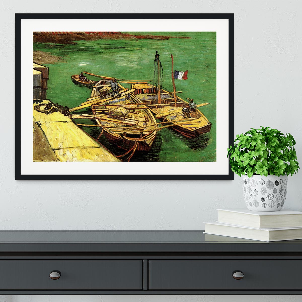Framed print of Van Gogh's Quay with Men Unloading Sand Barges, showcasing vibrant colors and intricate details.