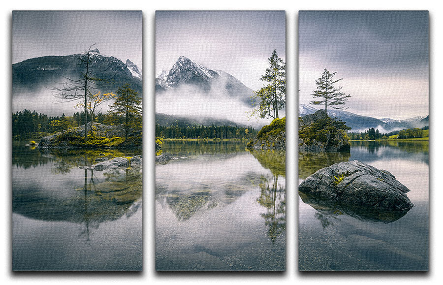 A beautiful 3-panel canvas print depicting a rainy morning at Hintersee, Bavaria, showcasing serene waters and lush mountains.