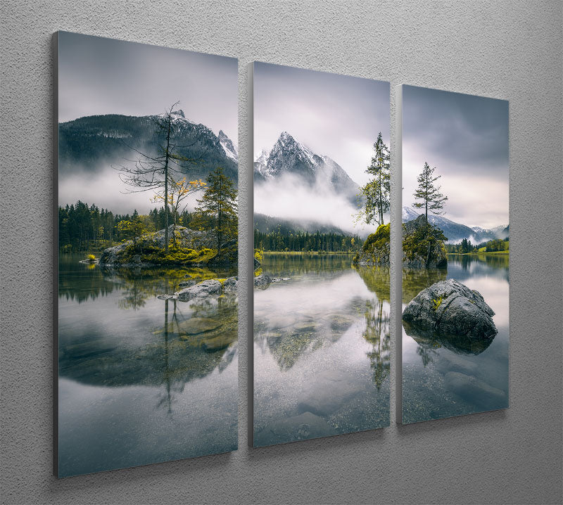 A beautiful 3-panel canvas print depicting a rainy morning at Hintersee, Bavaria, showcasing serene waters and lush mountains.