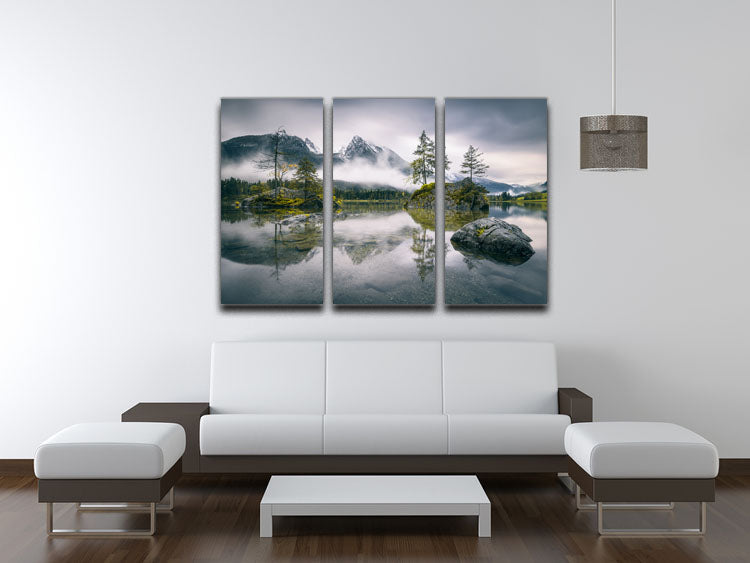 A beautiful 3-panel canvas print depicting a rainy morning at Hintersee, Bavaria, showcasing serene waters and lush mountains.