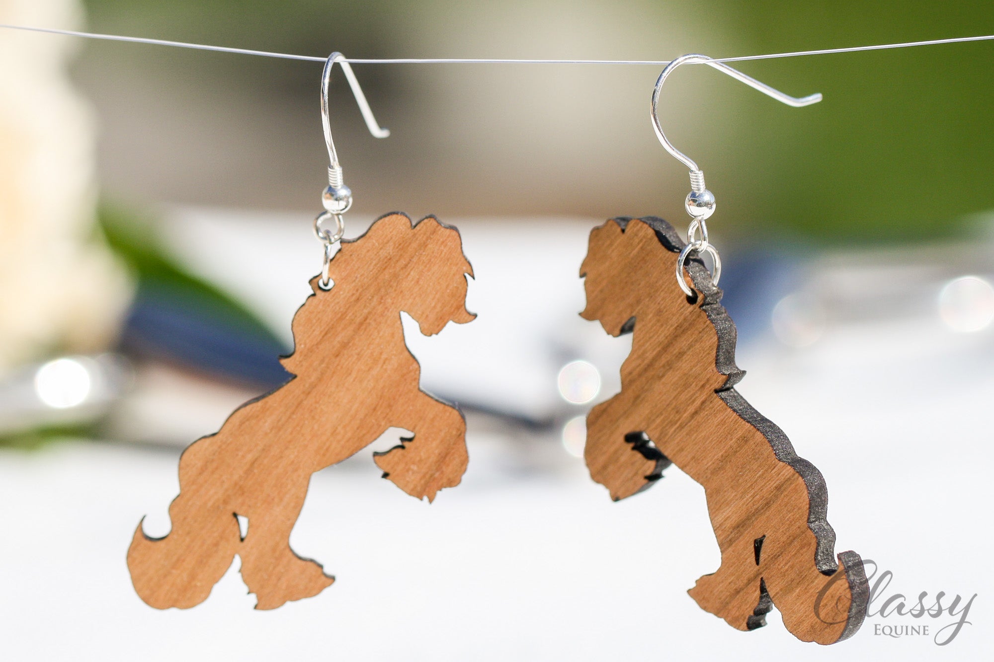 A pair of Rearing Gypsy Cob hardwood earrings, laser cut from cherry or walnut, showcasing intricate horse designs.
