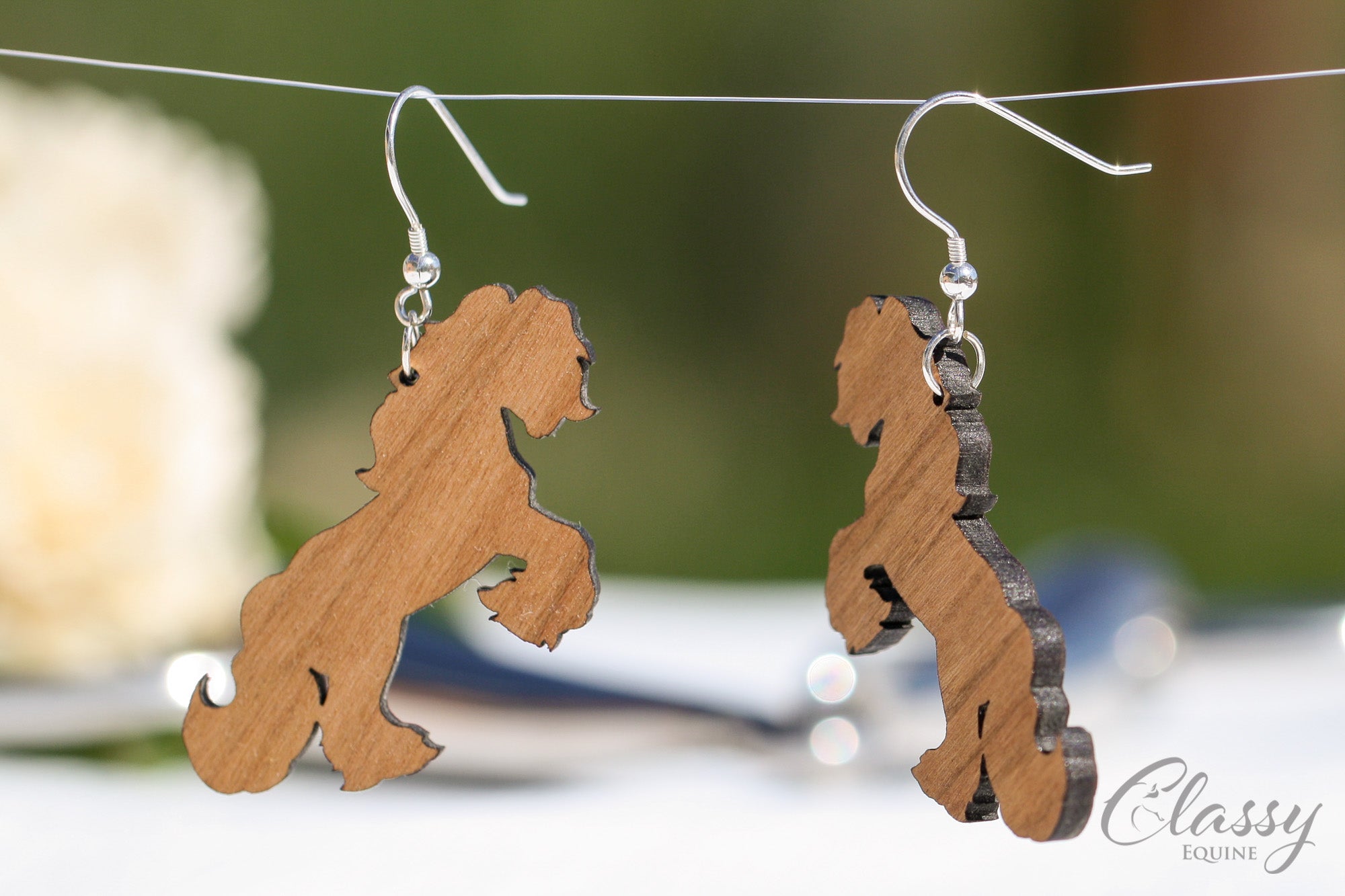 A pair of Rearing Gypsy Cob hardwood earrings, laser cut from cherry or walnut, showcasing intricate horse designs.