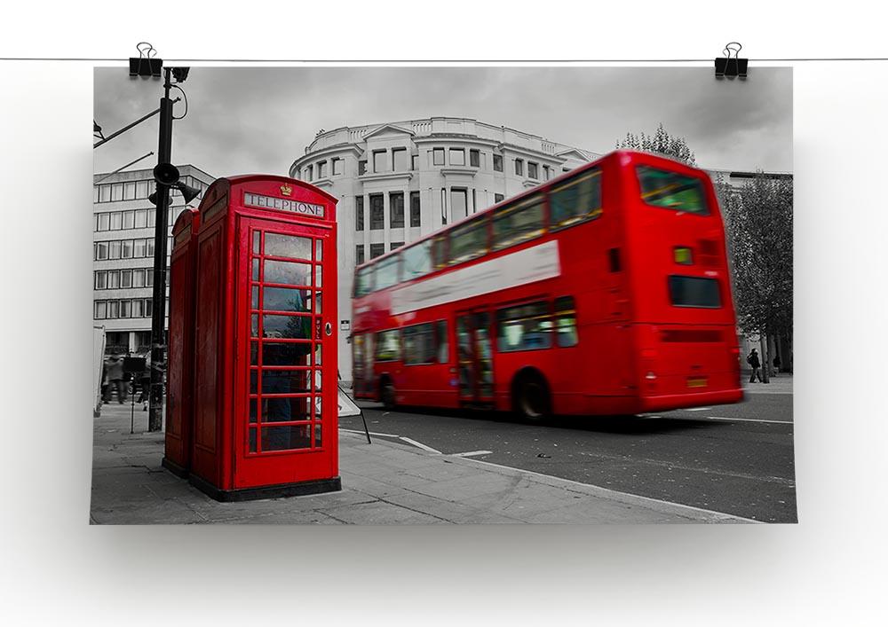 A vibrant canvas print featuring a classic red phone booth and red double-decker bus, symbolizing London charm and culture.