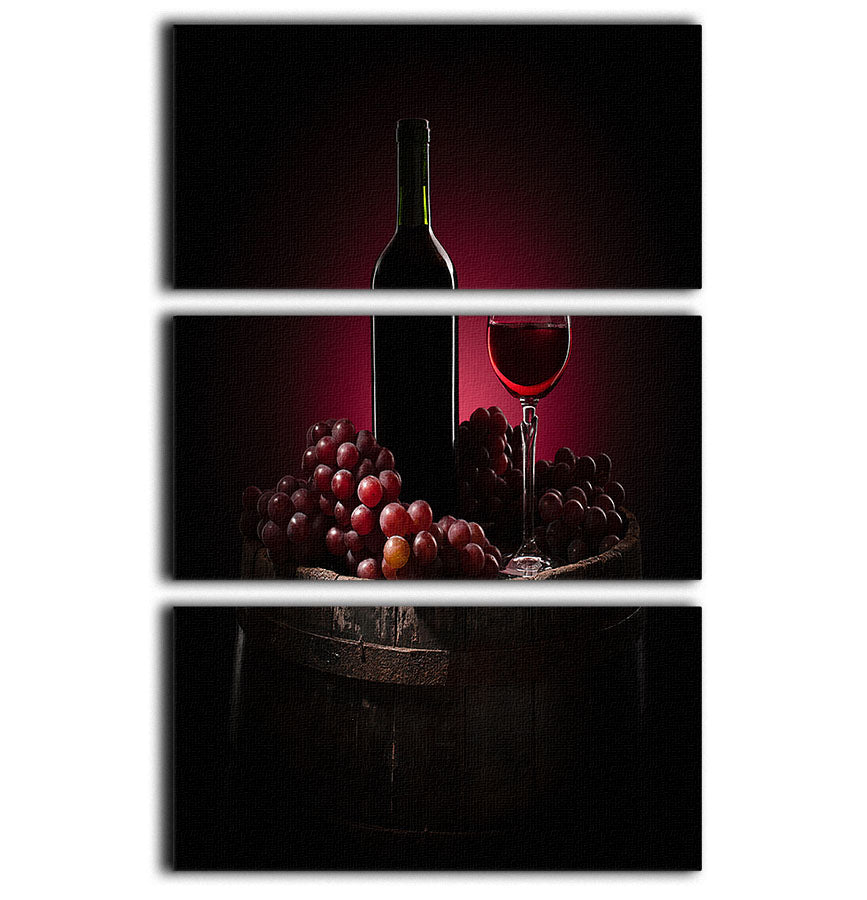A beautiful 3-panel canvas print featuring red wine and grapes, perfect for home decor.