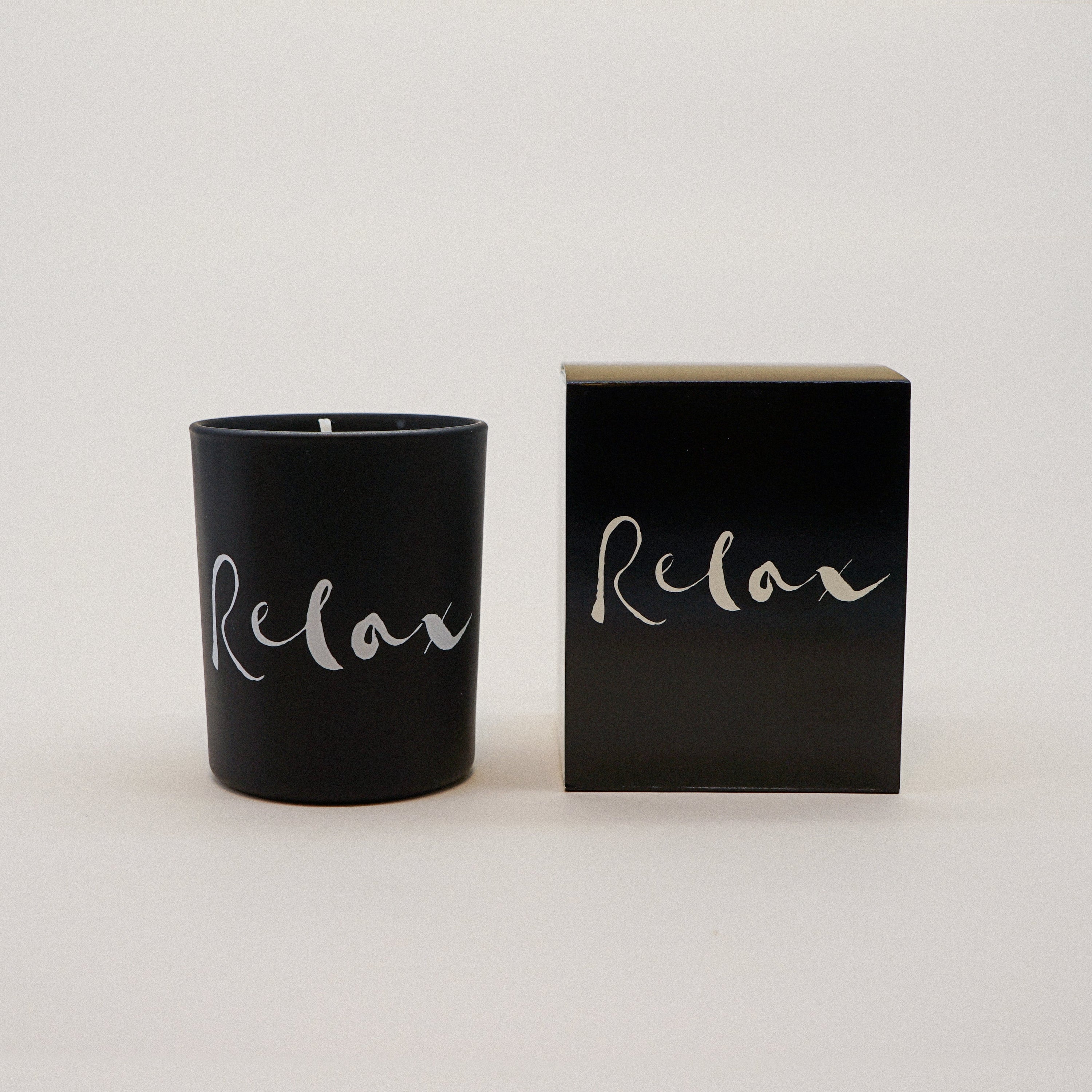 Relax Natural Wax Candle Set in elegant black glass with a relaxing brush painting design, showcasing its luxurious and calming essence.