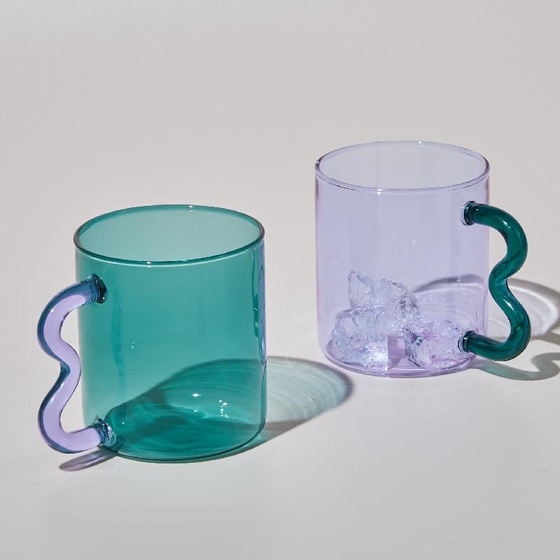 A colorful Retro Wavy Mug with a stained-glass finish and ergonomic handle, showcasing its unique design and vibrant colors.