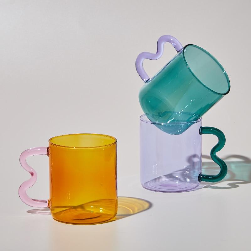 A colorful Retro Wavy Mug with a stained-glass finish and ergonomic handle, showcasing its unique design and vibrant colors.