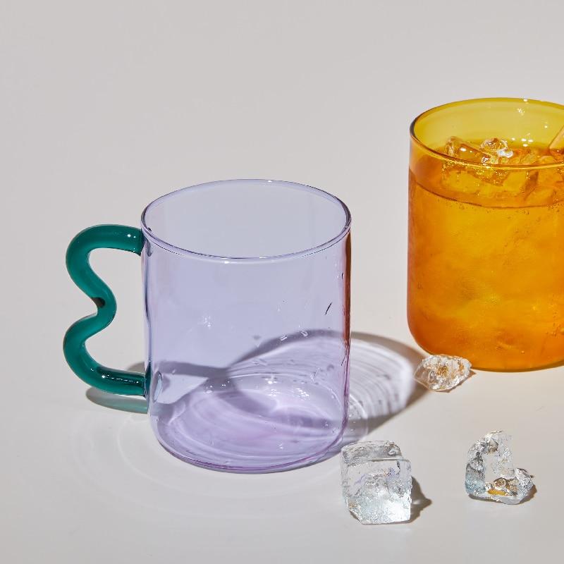 A colorful Retro Wavy Mug with a stained-glass finish and ergonomic handle, showcasing its unique design and vibrant colors.