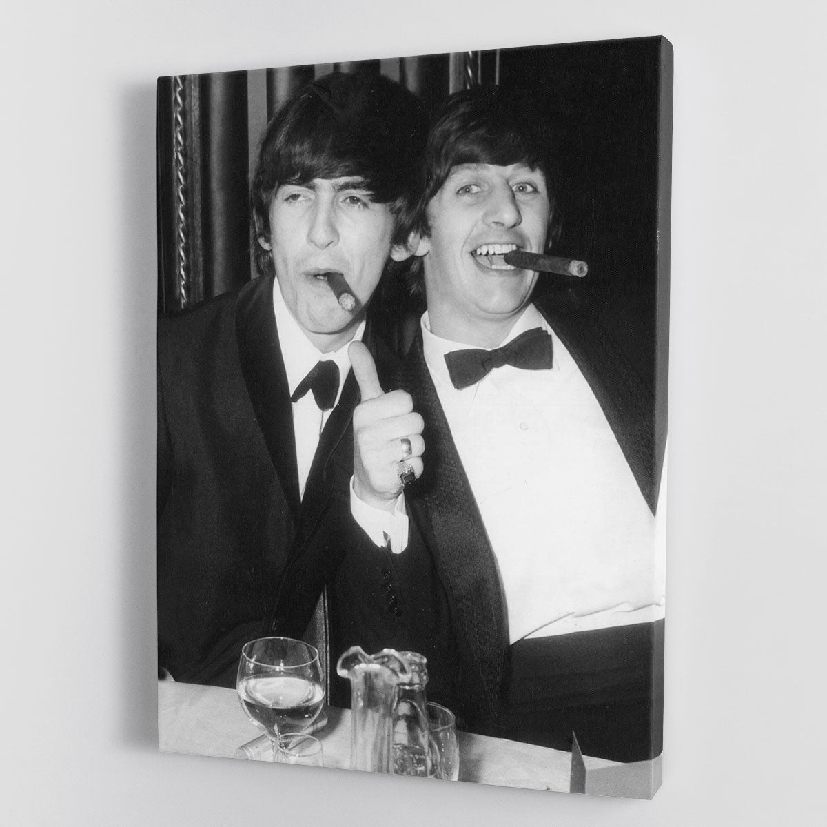 Canvas print featuring Ringo Starr and George Harrison smoking cigars, showcasing their iconic presence in music history.
