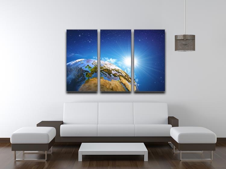 A beautiful 3-panel canvas print depicting the rising sun over Earth, showcasing diverse landforms in vibrant colors.