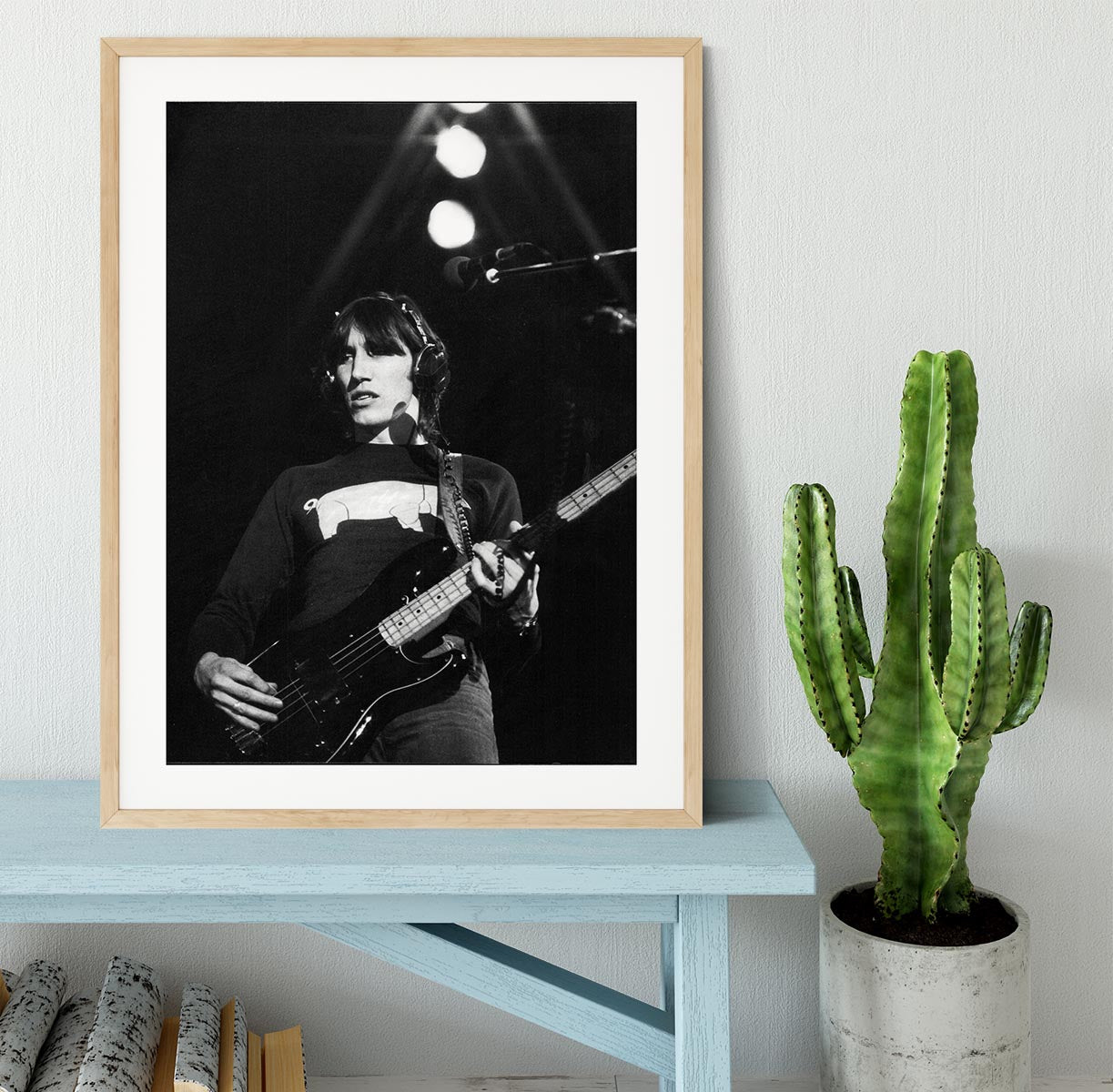 A beautifully framed print of Roger Waters, showcasing vibrant colors and high-quality craftsmanship in a stylish frame.