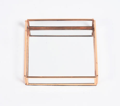 Rose-gold stainless steel and glass vanity tray, showcasing elegant design and craftsmanship.