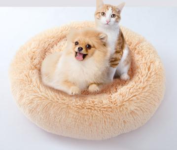 Round shape dog kennel and cat bed in candy colors, made of plush material, providing warmth and comfort for pets.