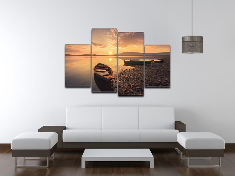 A beautiful 4-split canvas artwork depicting rowing boats against a vibrant sunset, creating a serene and dynamic visual experience.