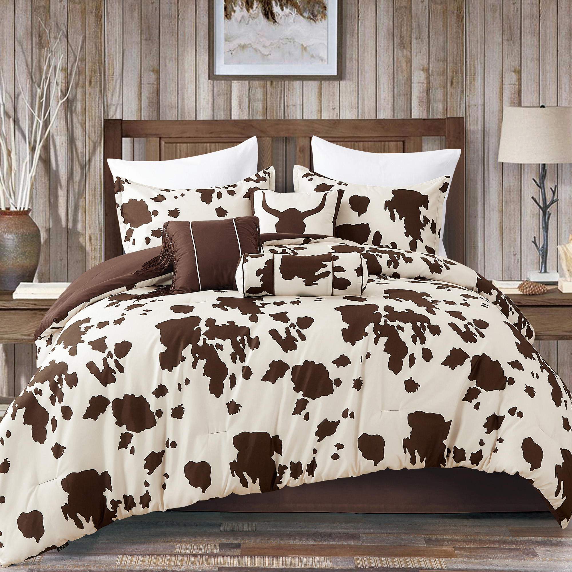 Rustic Cowhide Brown Cow Skull Comforter Set displayed on a bed, featuring a luxurious design with matching pillows and bed skirt.