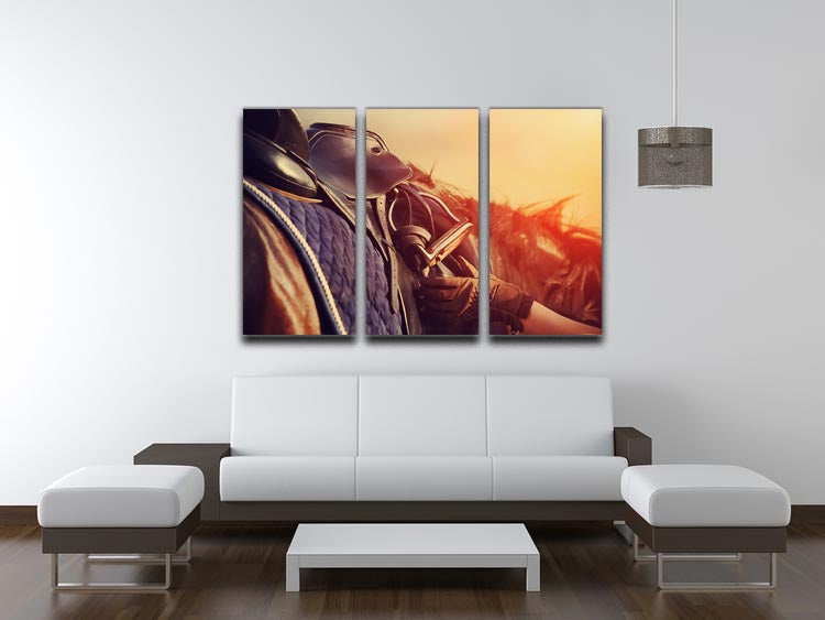 A stunning 3-panel canvas print featuring a saddle with stirrups on a horse's back, showcasing equestrian art.