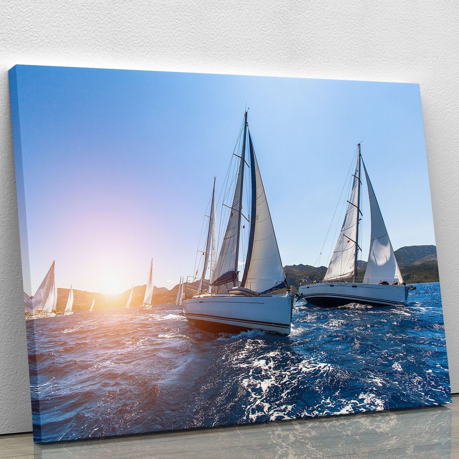 A vibrant canvas print depicting a sailboat navigating through waves under a clear blue sky, capturing the essence of adventure and tranquility.