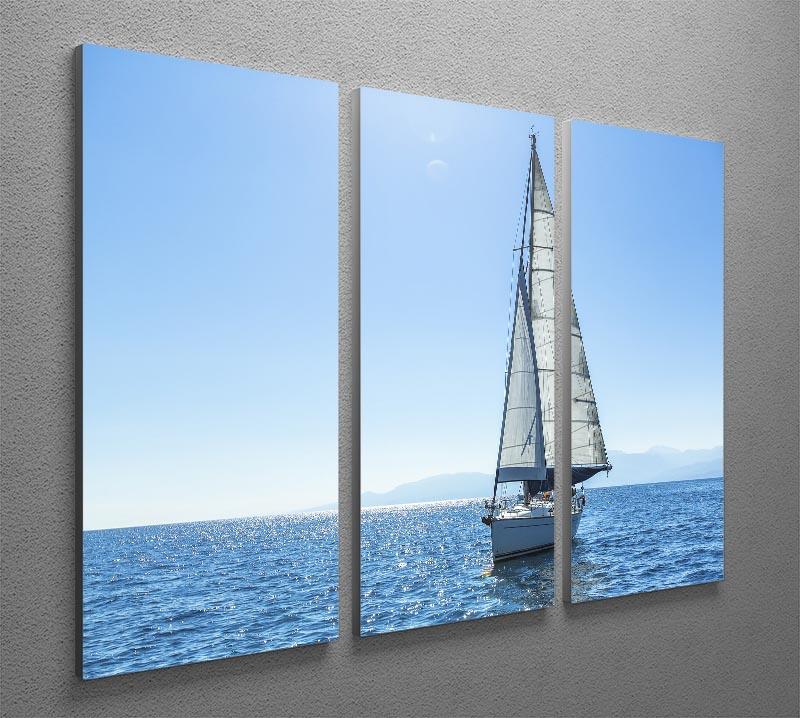 A beautiful 3-panel canvas print featuring sailing ships with white sails against a serene backdrop, perfect for home decor.