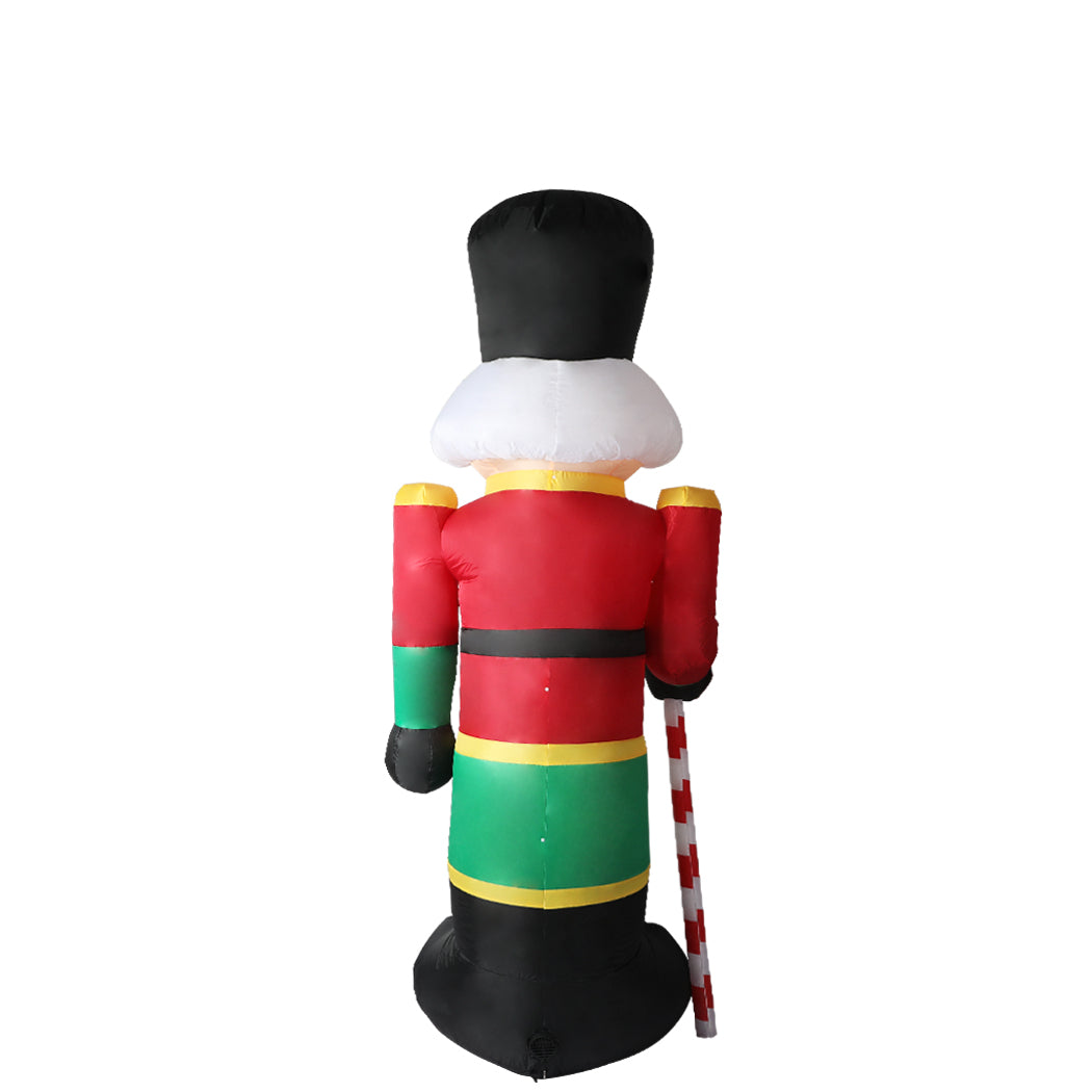 A large inflatable Christmas nutcracker standing 2.4 meters tall, adorned with colorful LED lights, set against a festive outdoor backdrop.