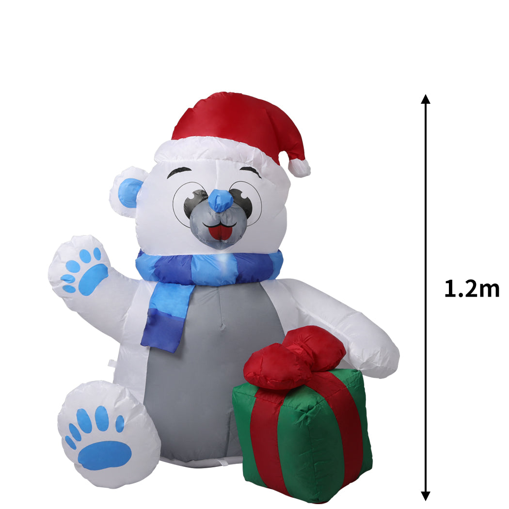A 1.2M inflatable Christmas polar bear with LED lights, standing in a festive yard, showcasing its cheerful design and bright illumination.