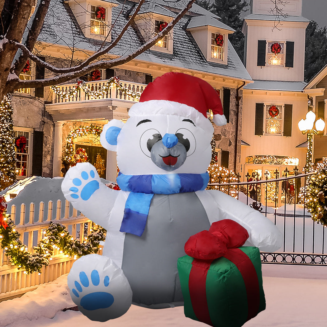 A 1.2M inflatable Christmas polar bear with LED lights, standing in a festive yard, showcasing its cheerful design and bright illumination.