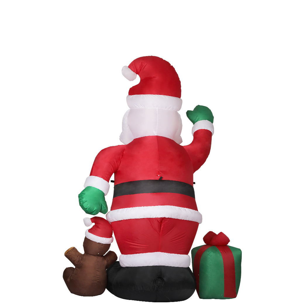 A large inflatable Santa Claus decoration with LED lights, standing 2.4 meters tall, set up outdoors for Christmas festivities.