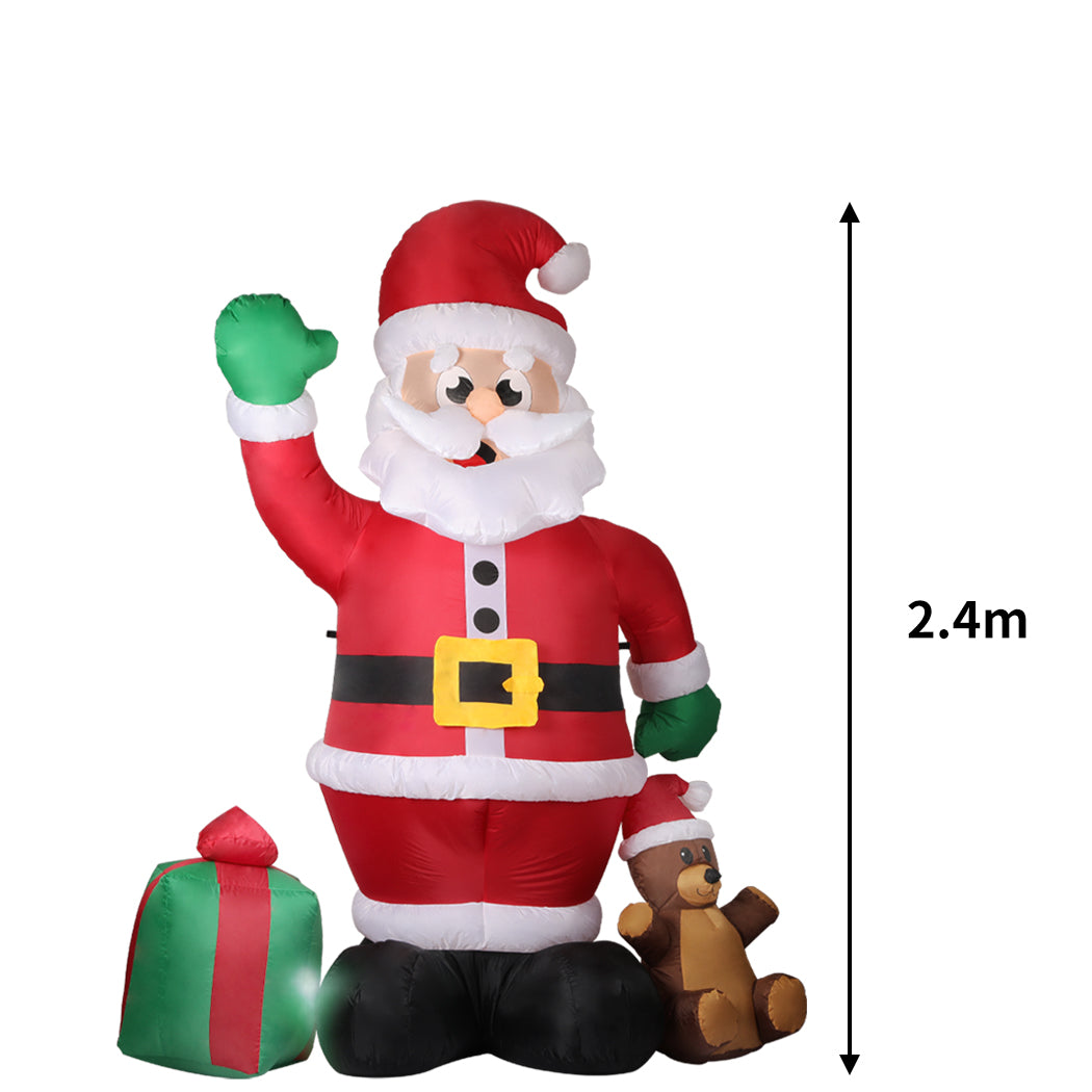 A large inflatable Santa Claus decoration with LED lights, standing 2.4 meters tall, set up outdoors for Christmas festivities.