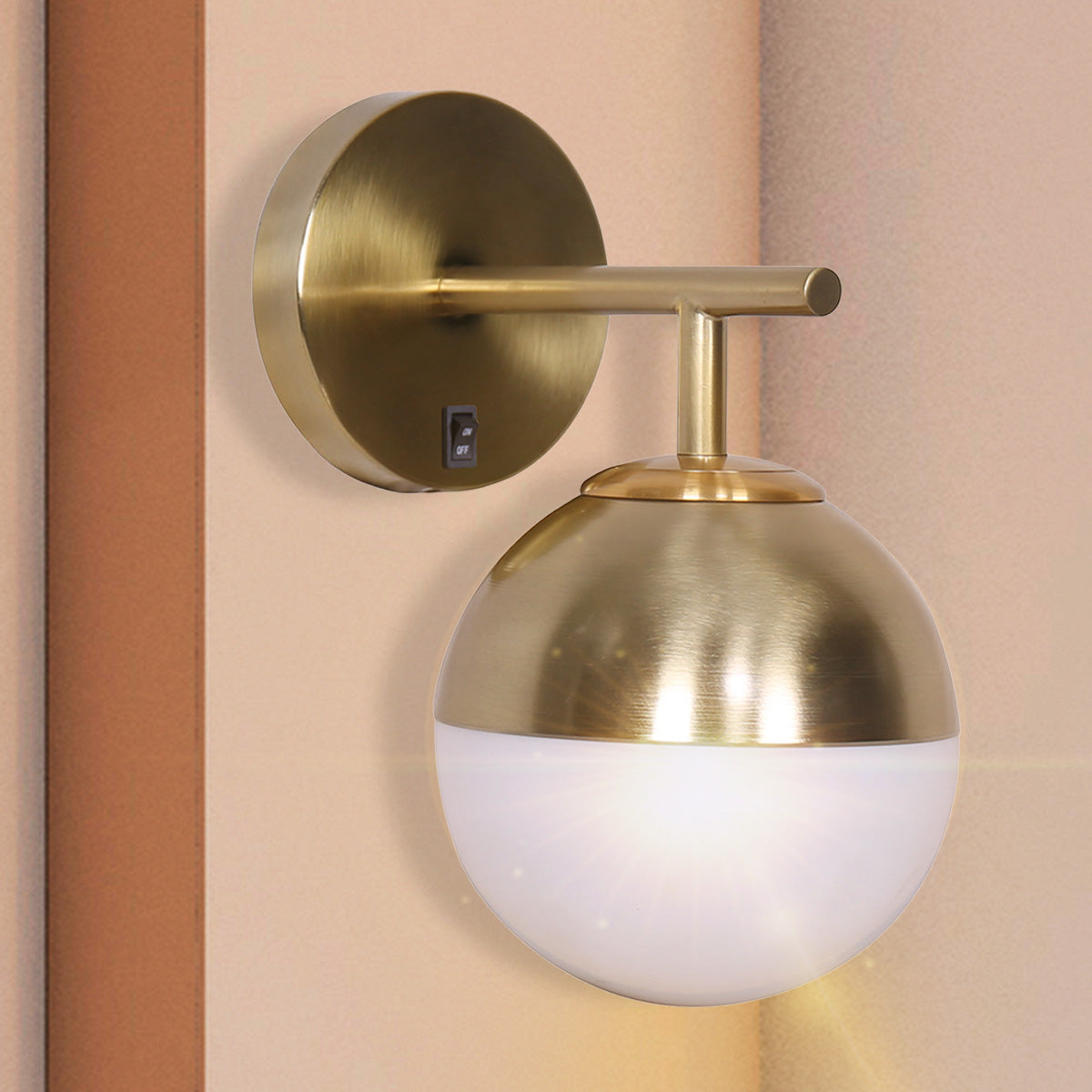 Sarantino Wall Lamp featuring a gold metal base and a white frosted glass globe shade, ideal for modern decor.
