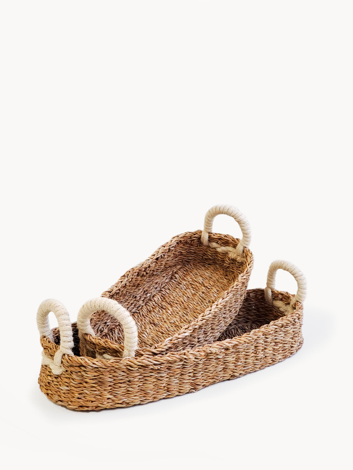 Savar Bread Basket with White Handle, handmade from seagrass, showcasing its natural color and jute handle.