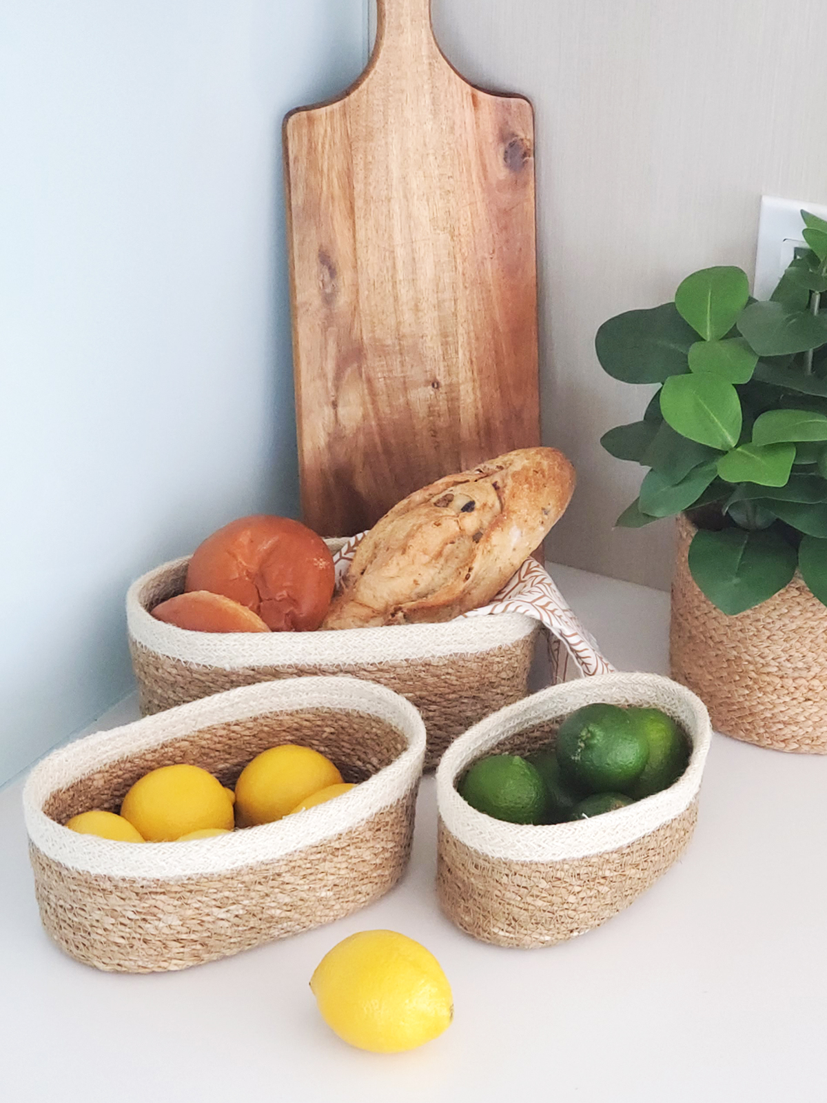 Set of three Savar Oval Bowls made from seagrass and jute, showcasing their natural and rustic design.