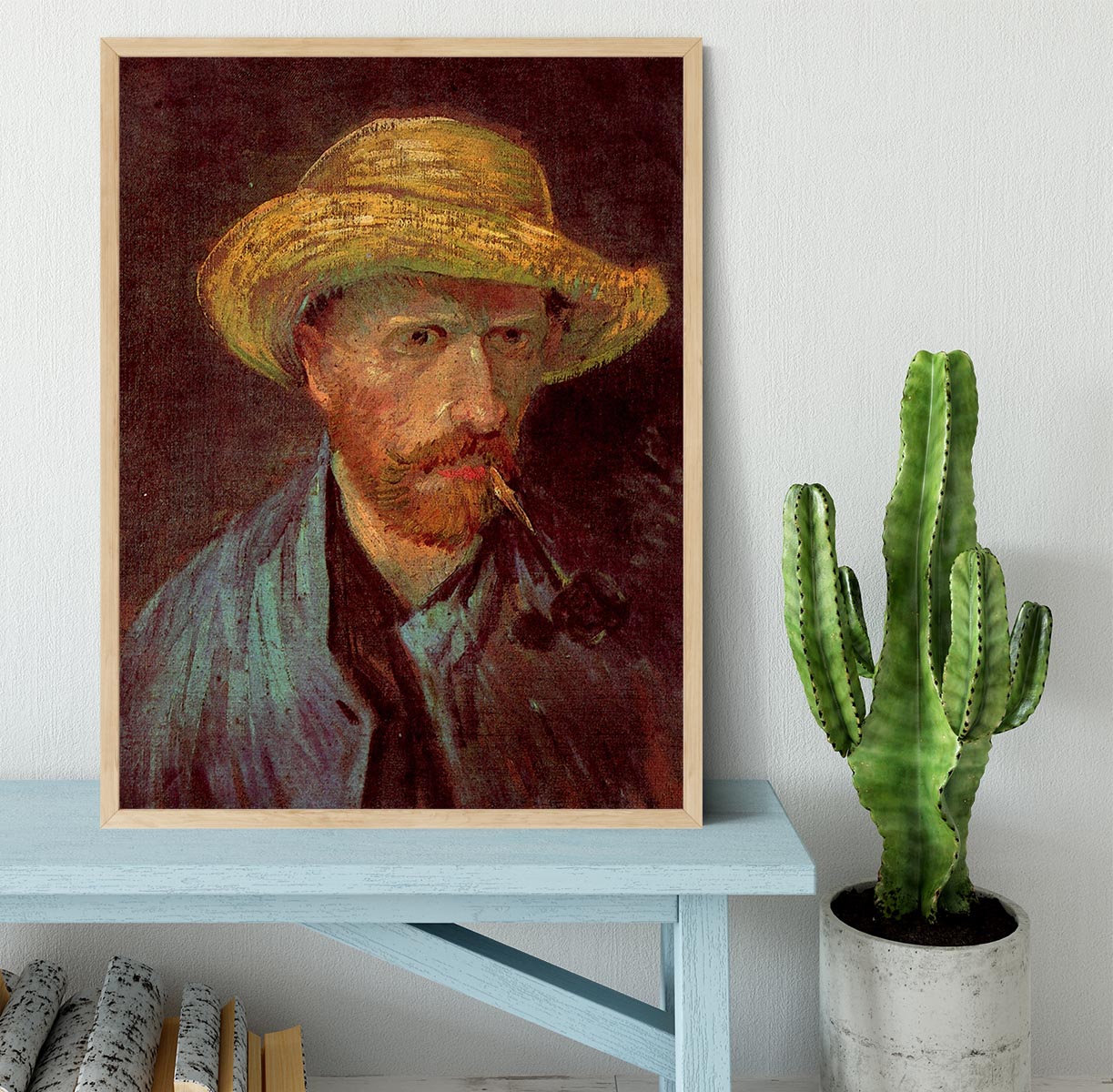 Framed print of Van Gogh's Self-Portrait with Straw Hat and Pipe, showcasing vibrant colors and quality craftsmanship.