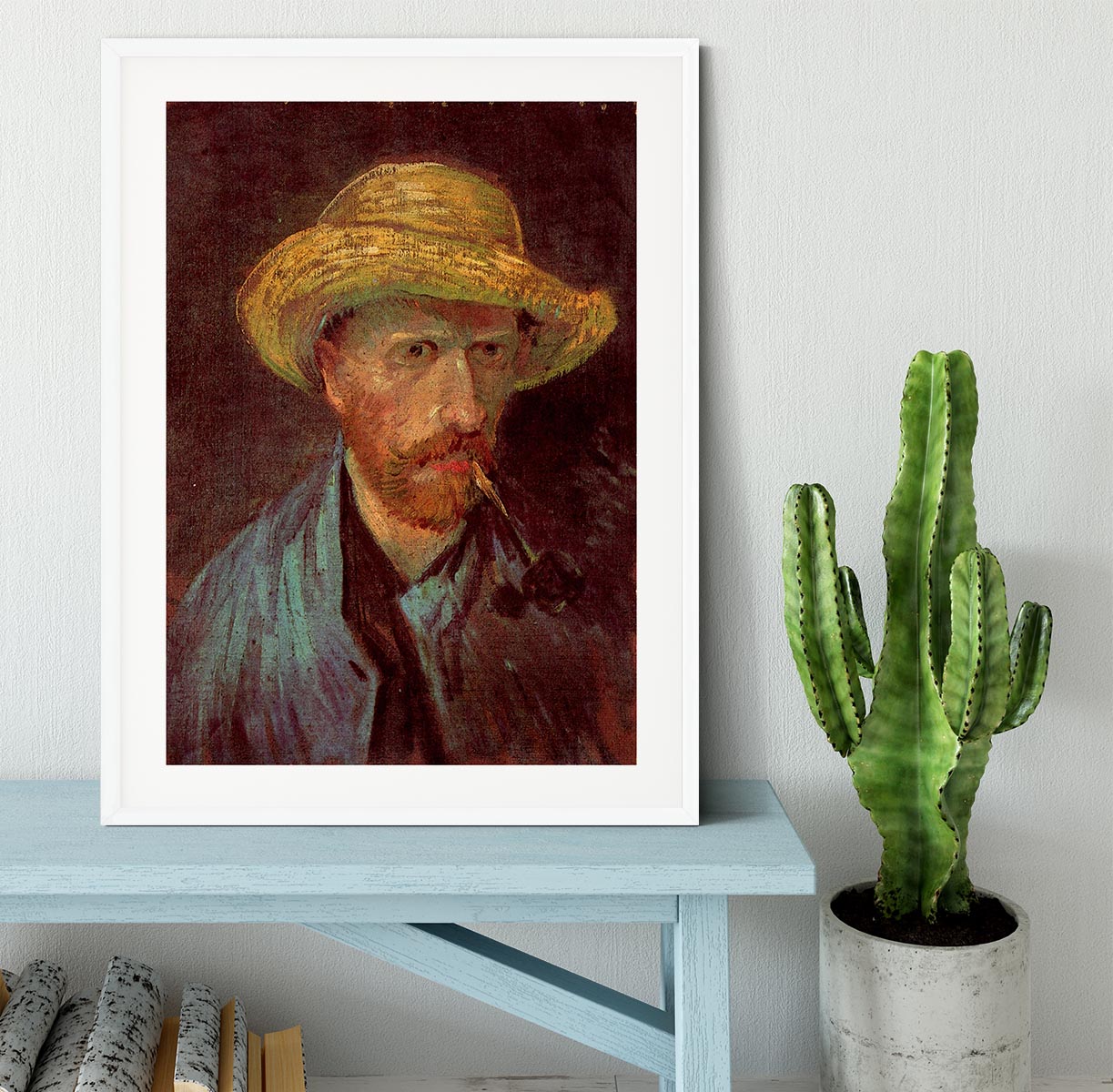 Framed print of Van Gogh's Self-Portrait with Straw Hat and Pipe, showcasing vibrant colors and quality craftsmanship.