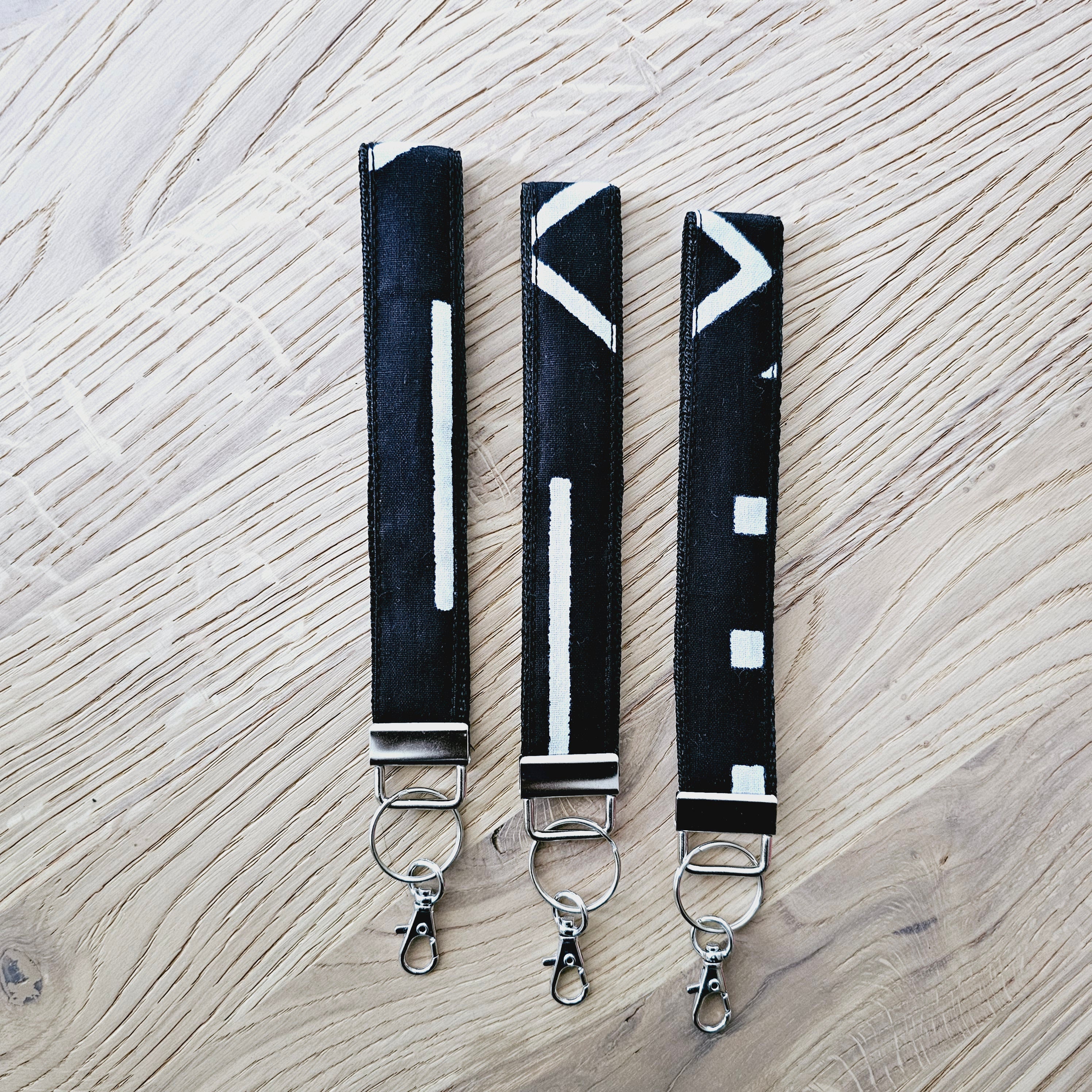 Set of 3 vibrant African print key fobs, featuring a stylish wristlet design and vegan leather lining for durability.