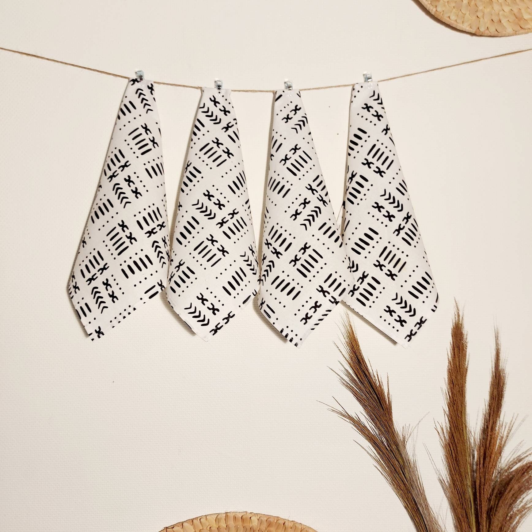 Set of 4 or 8 white mudcloth print napkins, showcasing a stylish African design on premium cotton fabric.