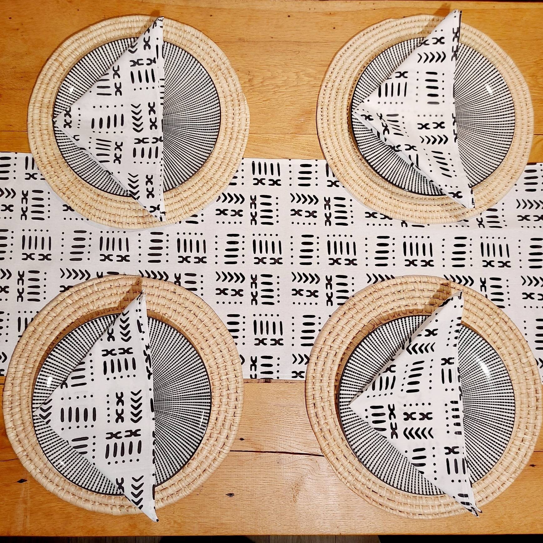 Set of 4 or 8 white mudcloth print napkins, showcasing a stylish African design on premium cotton fabric.