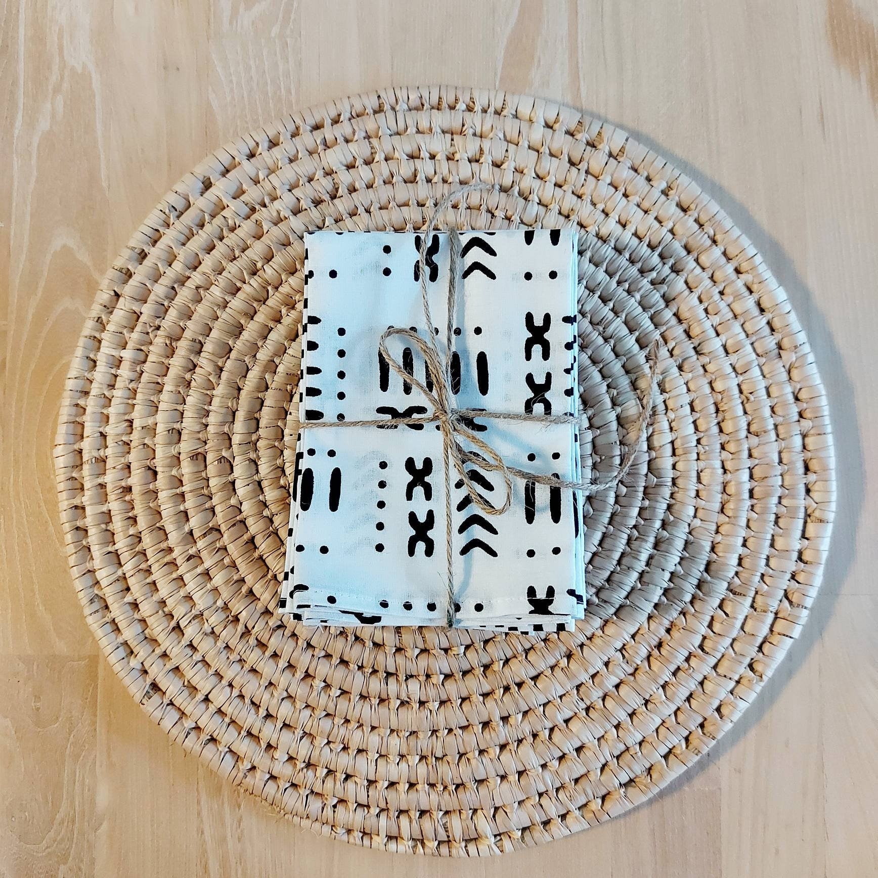 Set of 4 or 8 white mudcloth print napkins, showcasing a stylish African design on premium cotton fabric.