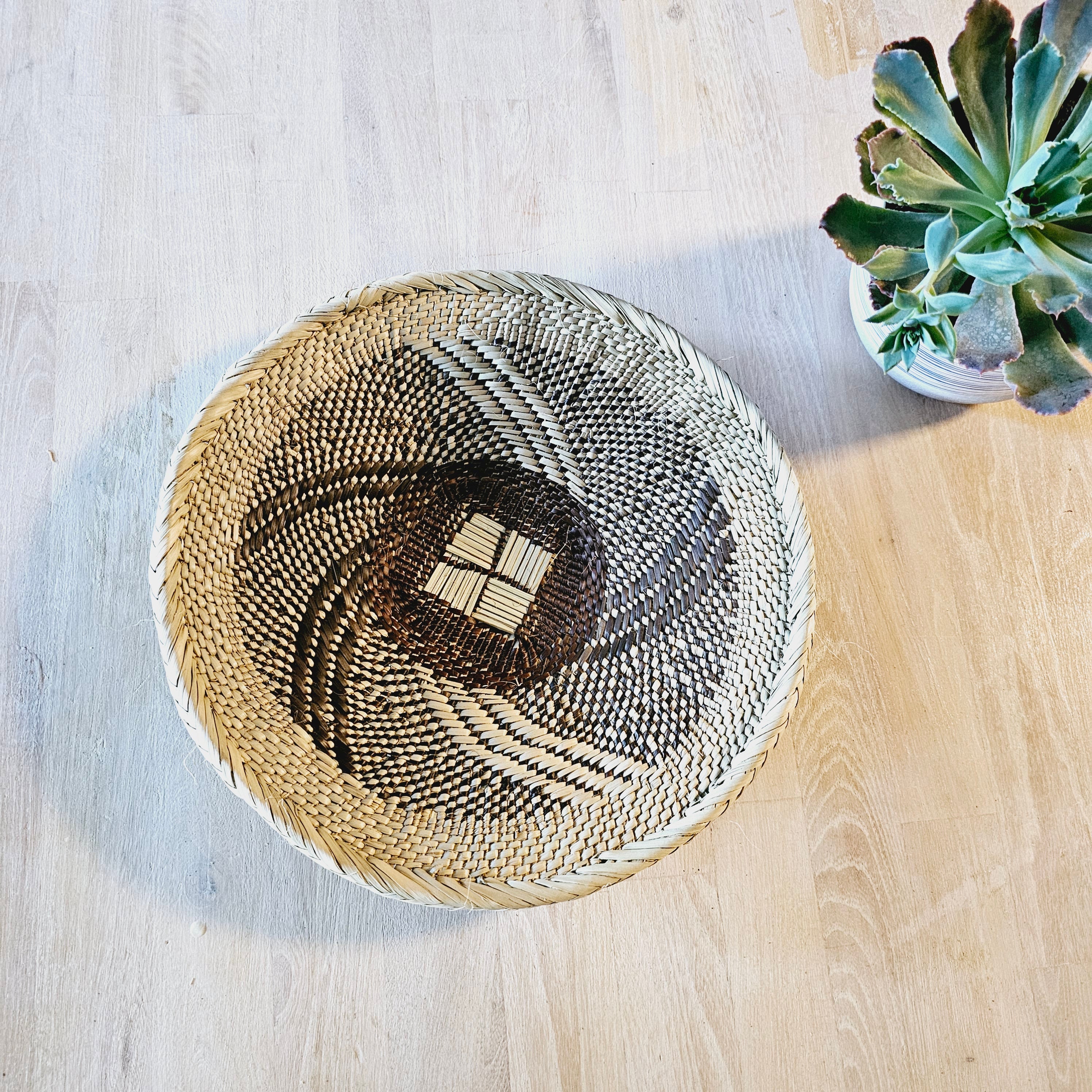 Set of 4 handmade African baskets from Zimbabwe, showcasing intricate patterns and natural materials, perfect for Boho wall decor.