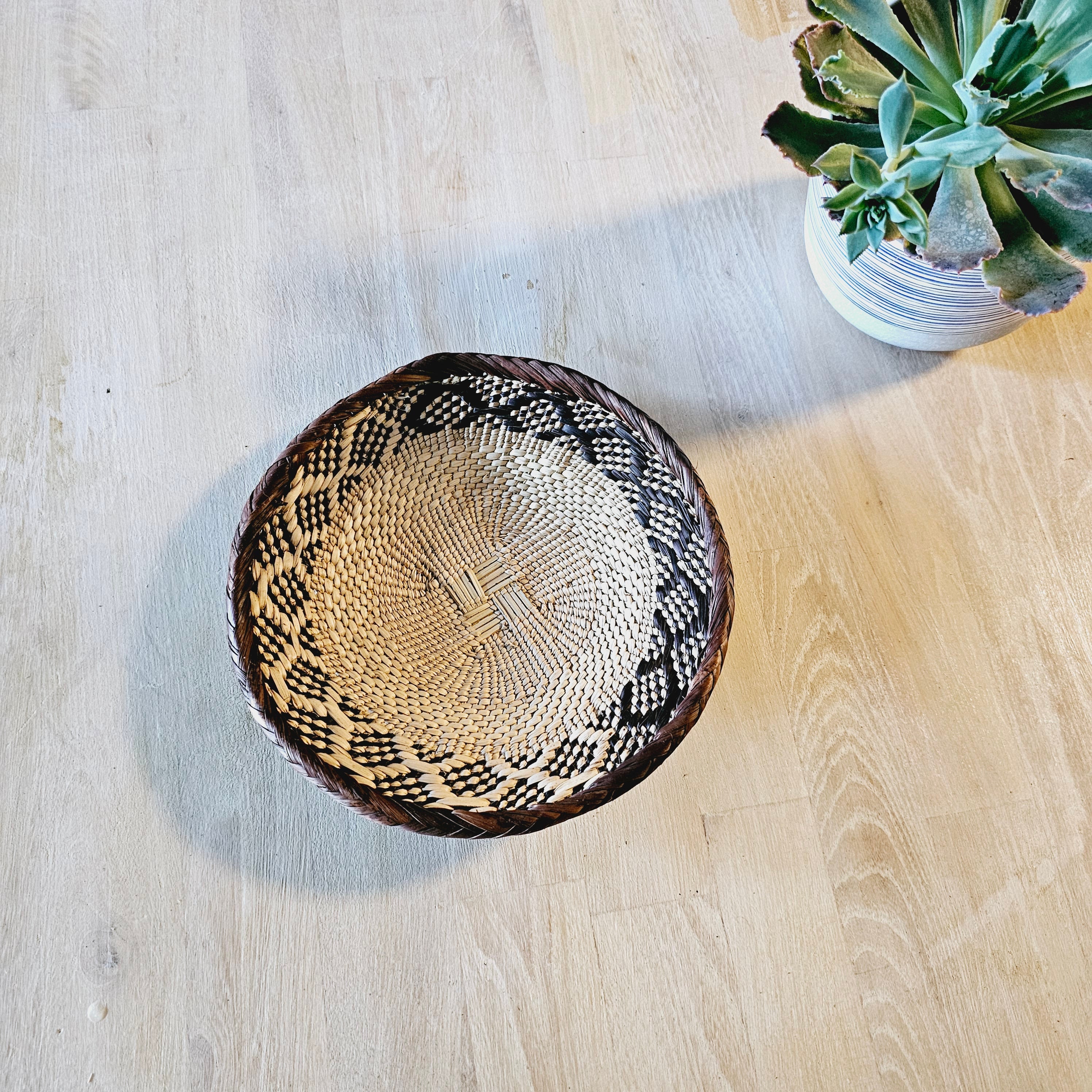 Set of 4 handmade African baskets from Zimbabwe, showcasing intricate patterns and natural materials, perfect for Boho wall decor.