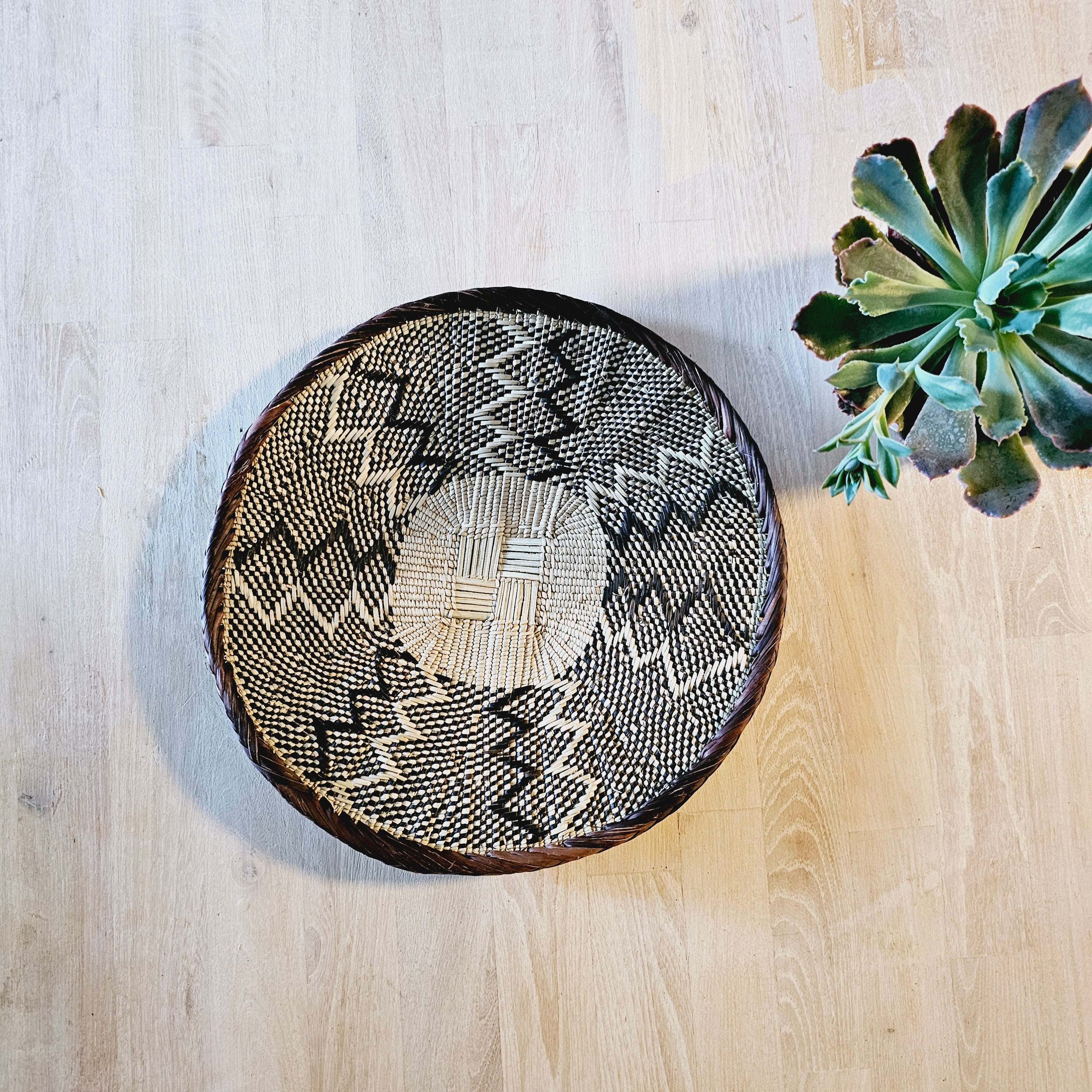 Set of 4 handmade African baskets from Zimbabwe, showcasing intricate patterns and natural materials, perfect for Boho wall decor.