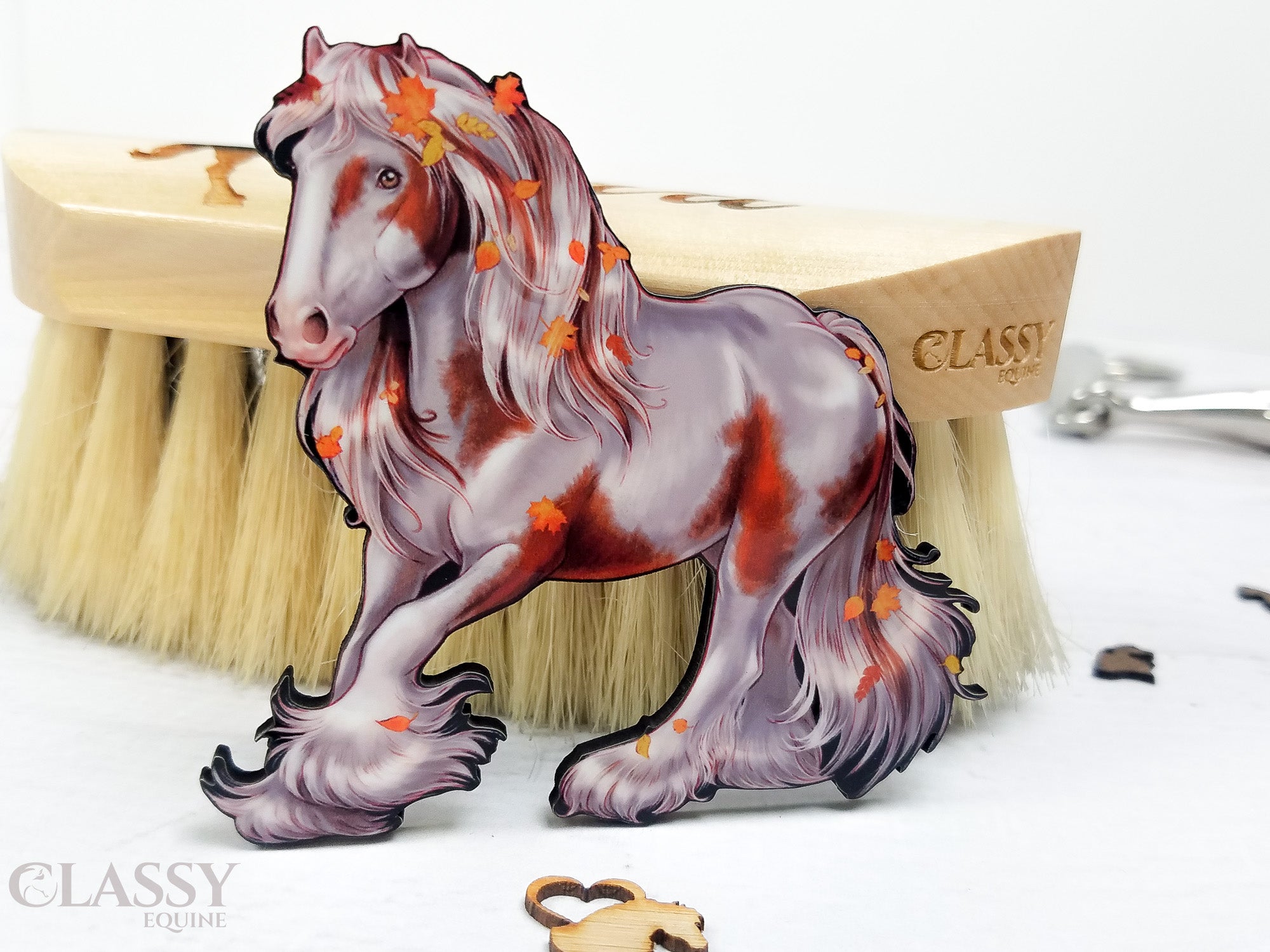 Set of two handmade Autumn Gypsy Horse ornaments, intricately designed and crafted from composite wood, featuring ribbons for hanging.