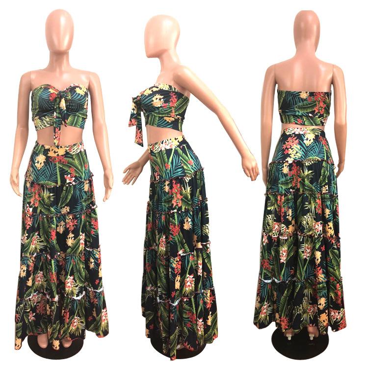 A stylish two-piece dress set featuring a strapless top and a tropical wrap skirt in vibrant green, perfect for summer outings.
