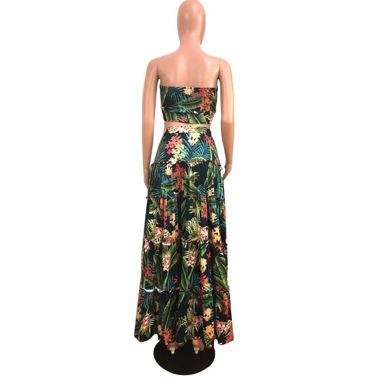 A stylish two-piece dress set featuring a strapless top and a tropical wrap skirt in vibrant green, perfect for summer outings.