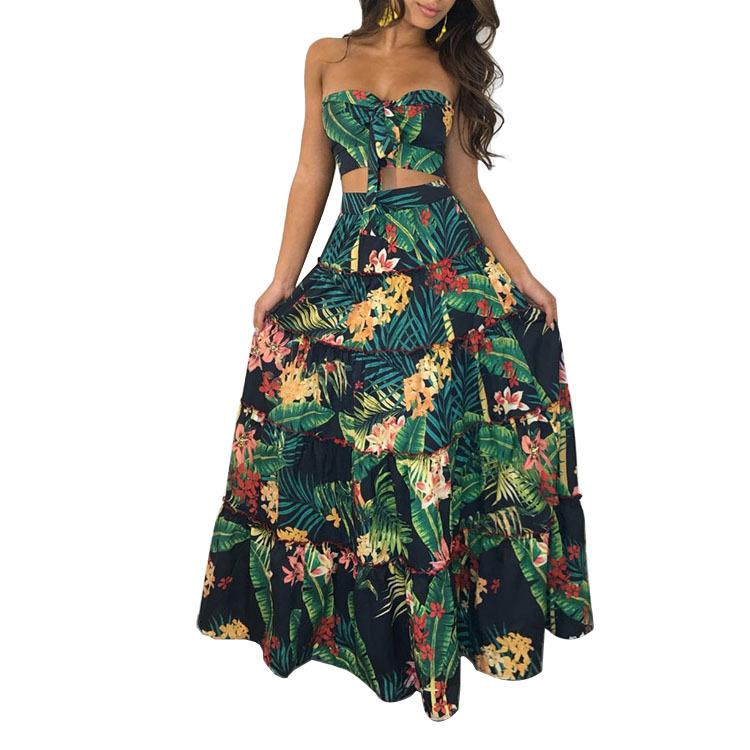 A stylish two-piece dress set featuring a strapless top and a tropical wrap skirt in vibrant green, perfect for summer outings.