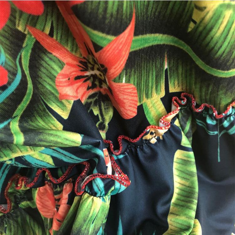 A stylish two-piece dress set featuring a strapless top and a tropical wrap skirt in vibrant green, perfect for summer outings.