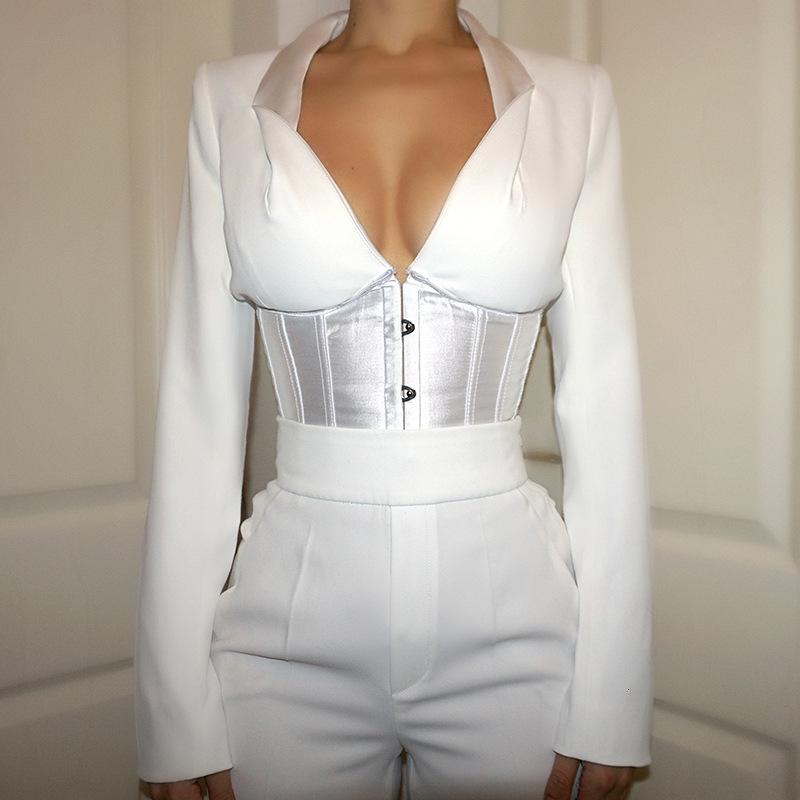 A stylish woman wearing a Sexy V Neck Bustier Blouse with lace-up details, showcasing elegance and fashion.